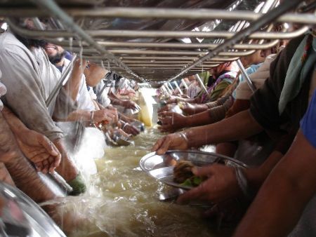 Volunteers doing seva or selfless service at the community kitchen in the Golden Temple compex. Seva or selfess service for humanity is an integral part of the Sikh way of life. 