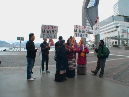 Protestors Holding Signs Outside the Convention Centre