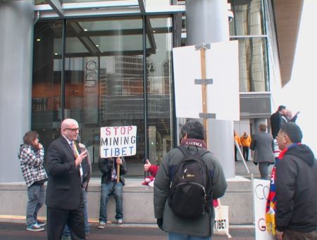 Protestor Speaking with Investors