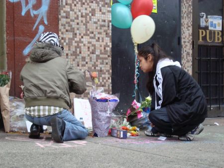 Mourners kneel before a vigil for Verna Simard //dp