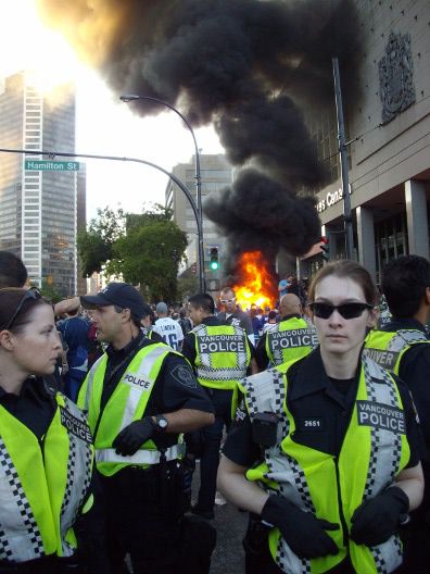 Scared cops stand by as car burns, June 15, 2011