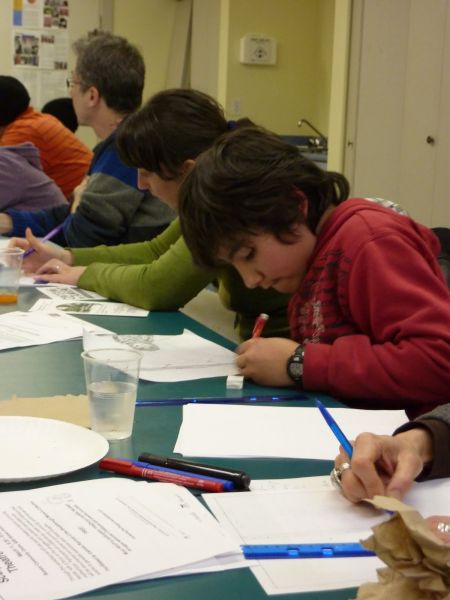 Intently drawing the next comic masterpiece