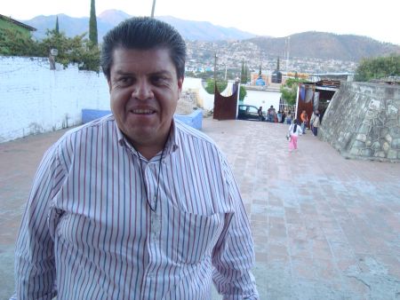 Padre Martín in front of his new parish in Oaxaca City. Photo by Dawn Paley.