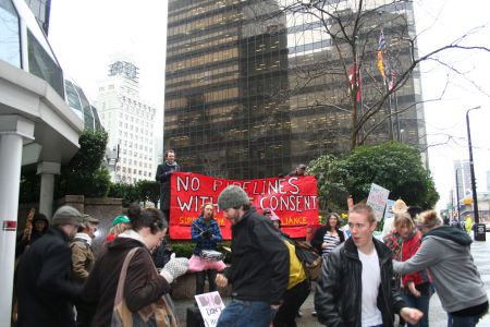 Dancing in the rain at the rally in against Enbridge's Northern Gateway pipeline project. Vancouver, March 22, 2011. Photo: Sandra Cuffe