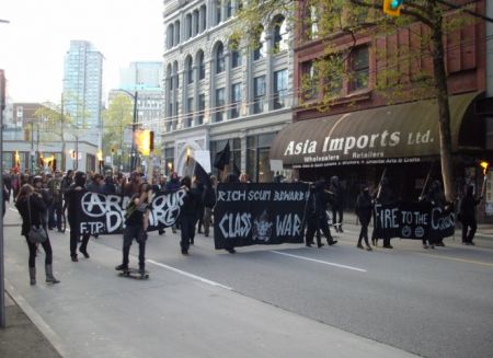 Marching east on Hastings Street carrying torches. Marching east on Hastings Street carrying torches.