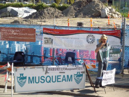 Banner and picketer at construction site.