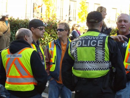 City of Vancouver workers and police, hand in hand