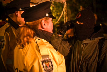 Protestor confronts police at an anti-Olympics demonstration in Victoria, BC // nofutureface