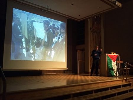 Dr John "Max" Soos shows a boy confronting occupation soldiers