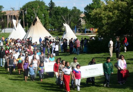 Children carried banners with the names of the residential schools in Saskatchewan. Photo: Sandra Cuffe