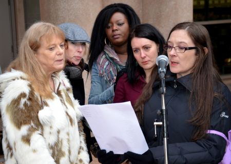 Reading the names of the missing women.   photo: murray bush - flux photo