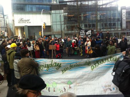 Over 100 people rally outside Apache offices in Vancouver in support of Unist'ot'en.