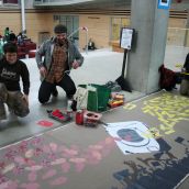 Melanie (fabulous community artist & activist) chats up Ivan as they work on the banner