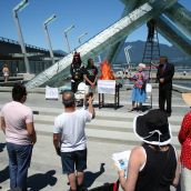 Crowd gathers for the Poverty Olympic Torch Relay