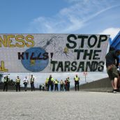 Putting up banner across the road on the overpass to The Port Of Vancouver