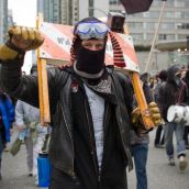 Anti-Olympic activist raises his fist in resistance to the 2010 Winter Games