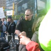 A police line set up near Canada Place in front of the bus carrying delegates that the protesters blocked