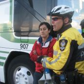 Police forcibly removed protesters standing next to the bus