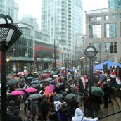 Many people braved the rain to attend the Vancouver rally in support of the uprisings in Egypt, Tunisia, and beyond. Photo: Sandra Cuffe