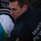Police assist torchbearer into cop car // Murray Bush