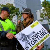 Protester telling the police officer he is facing the wrong way