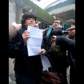 Outside: Ivanya Figueroa with letter by husband Jose - ordered deported for ties to the democratically-elected government of El Salvador