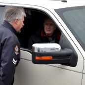 Police talk with the condo developer