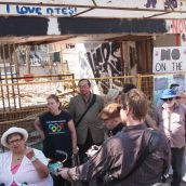 Downtown Eastside (DTES) residents gathered outside the Pantages demolition site on Monday, July 16 to draw attention to rats and rubble disaster that festered in their community for over a year, and to demand action from the City of Vancouver. Photo credit: Downtown Eastside Not for Developers Coalition