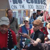 Downtown Eastside (DTES) residents gathered outside the Pantages demolition site on Monday, July 16 to draw attention to rats and rubble disaster that festered in their community for over a year, and to demand action from the City of Vancouver. Photo credit: Downtown Eastside Not for Developers Coalition