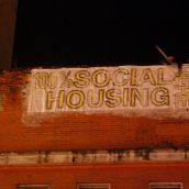 Housing activists paste a new marquee on the Pantages Theatre