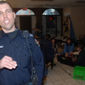 Police and circle of those refusing to leave the shelter