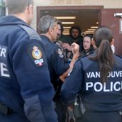 Police try to push into the shelter 