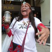 Secwepemc Warrior Kanahus Manuel with tainted creek water
