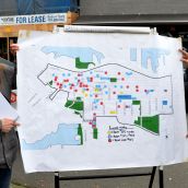 CCAP's Wendy Pederen and Jean Swanson with map of housing crisis  