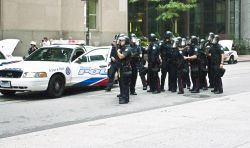 3:40:38  Police at intersection gather together on east side of King and Bay Streets