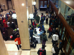 Activists chant, stick signed petitions & pound on the door to the SFU Govenors meeting