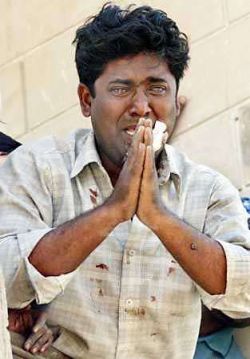 A young Muslim in Gujarat begging with tears not to harm him and his family, during the 2002 Gujarat massacre of muslims in India. A young Muslim in Gujarat begging with tears not to harm him and his family, during the 2002 Gujarat massacre of muslims in India.