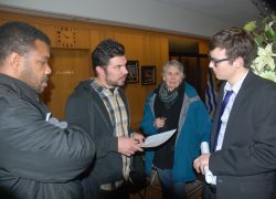 Activists Paul Martin, Ivan Drury and Jean Swanson grill City staffer.