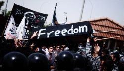 Kurds protested the torture and slaying of Zardasht Osman, a 23-year-old journalist, outside Parliament in Erbil, Iraq, last week.